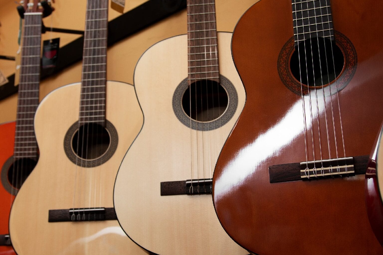 Photo of acoustic guitars used to illustrate a post about online guitar lessons.