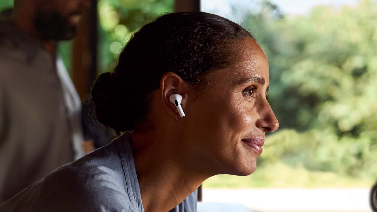 Woman smiling wearing AirPods