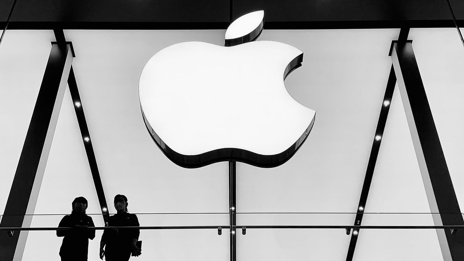 Apple Store logo in Chengdu, China with two people standing in front of it