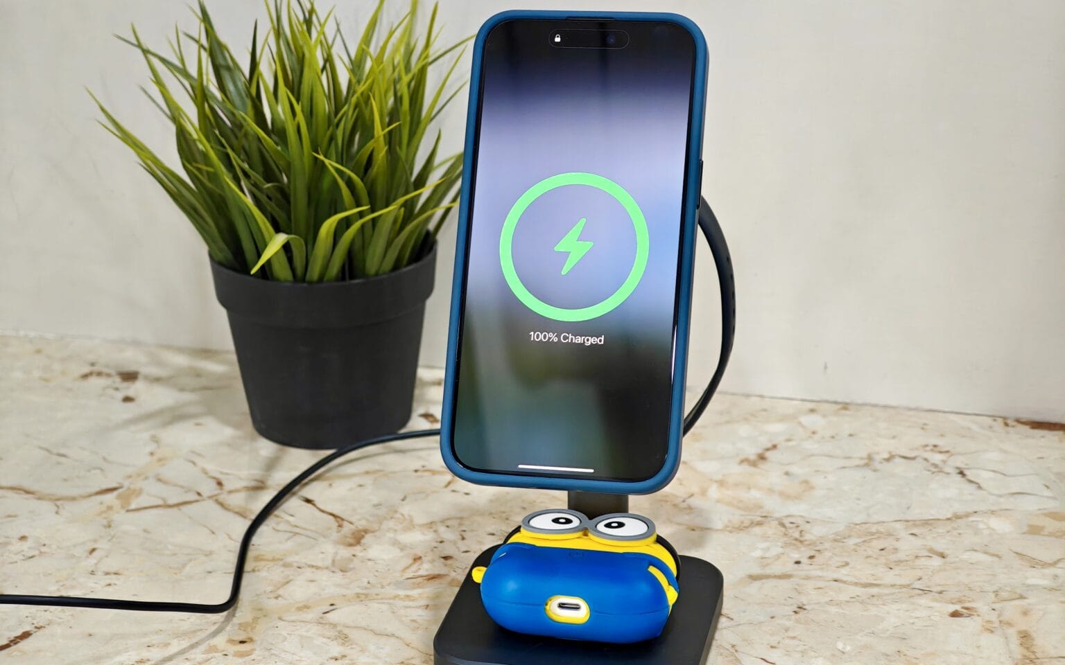 ESR Qi2 3-in-1 charging station showing iPhone and AirPods on charge