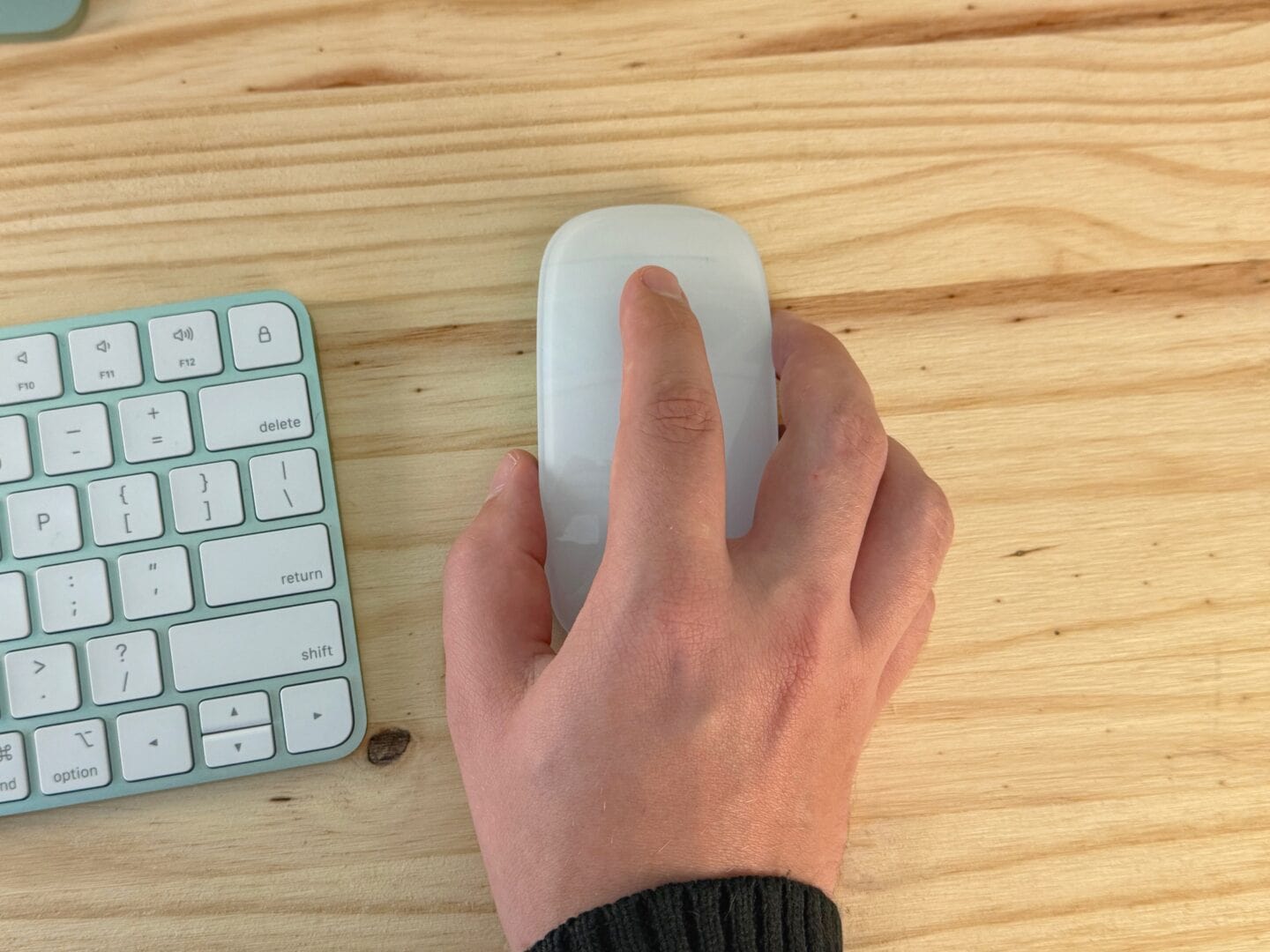 Holding a Magic Mouse uncomfortably